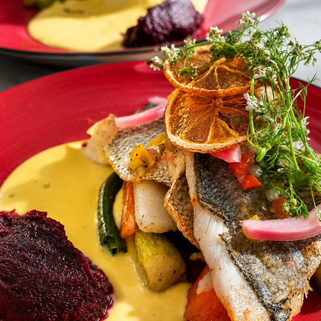 The morning's catch, grilled over coals and finished with saffron butter